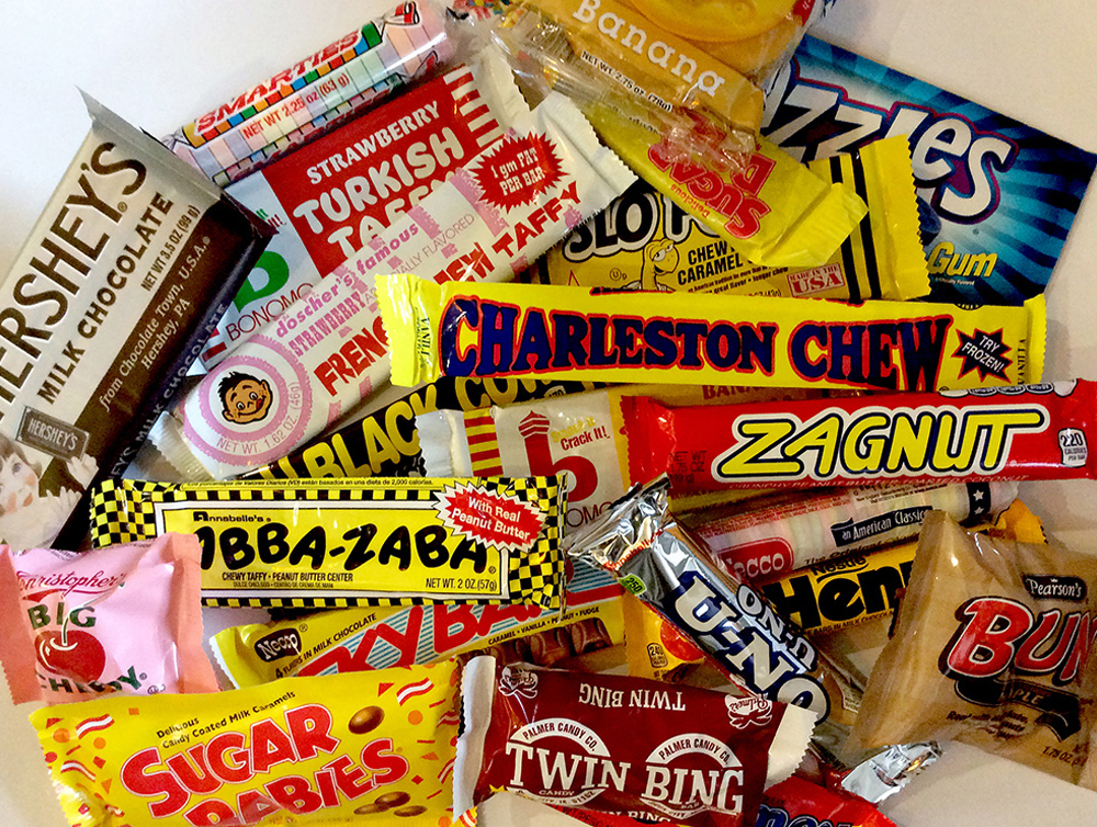Assortment of classic candy bars including Charleston Chew, Zagnut, Turkish Taffy, Sugar Babies, and Hershey’s chocolate